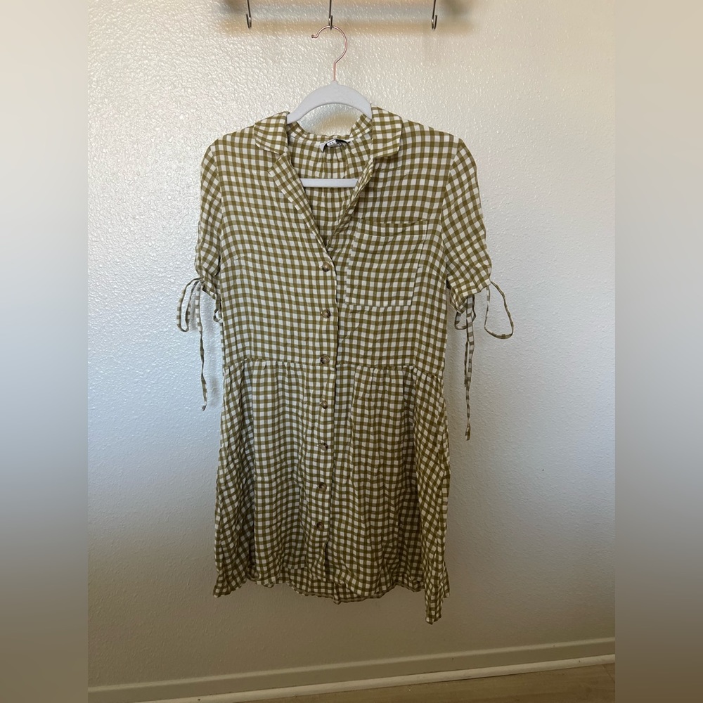 Green gingham buttoned mini dress.